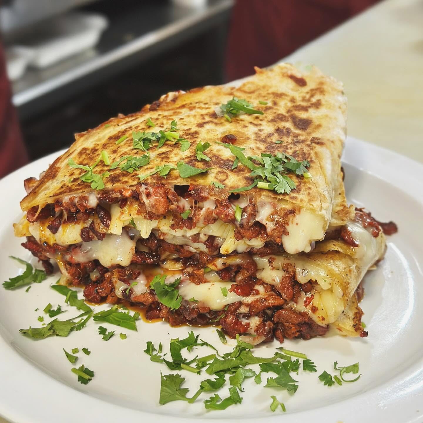 Golden, cheesy quesadilla with crispy toasted edges.